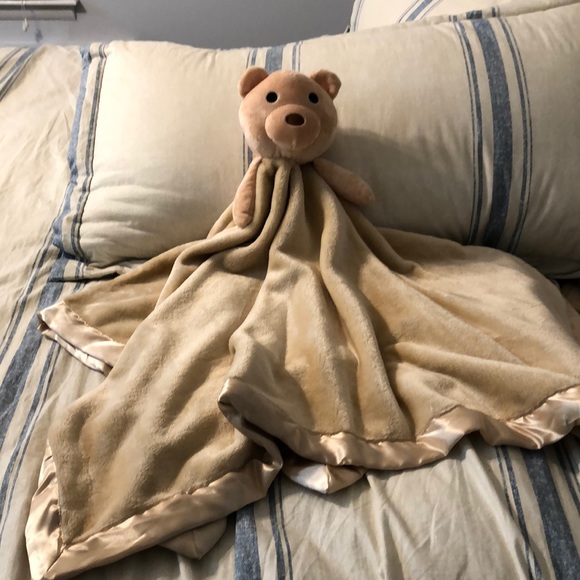 teddy bear with blanket attached